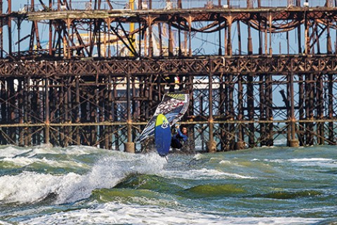 Nik Baker jumping in front of Brighton Pier