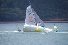 IMOCA 60 YACHT v FOIL WINDSURFER
