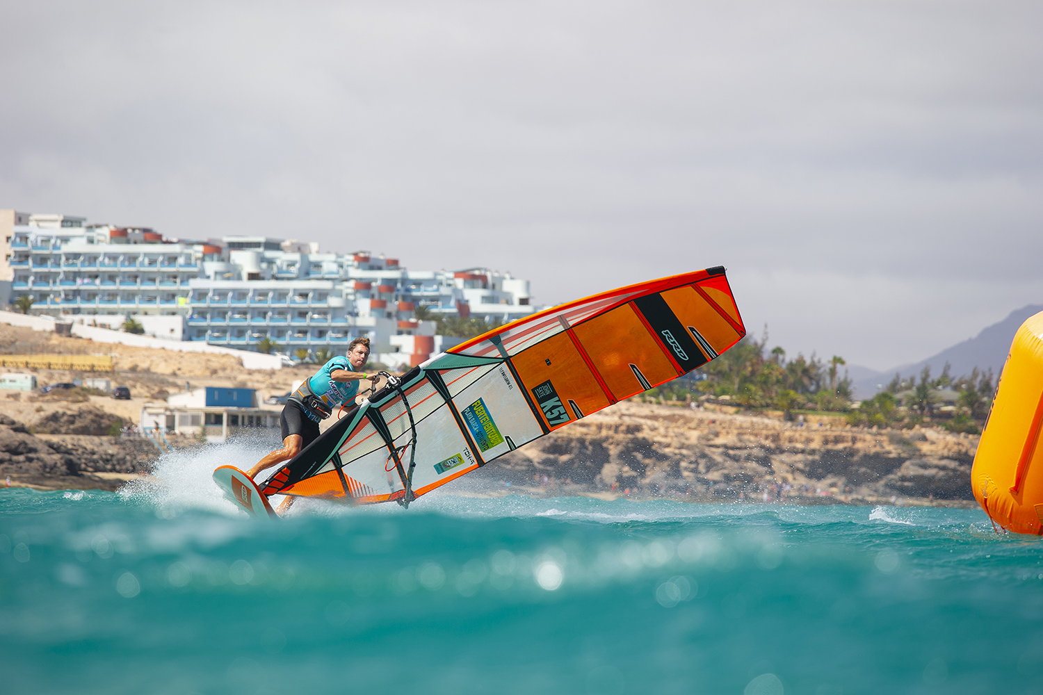 Click to Enlarge - John banking it round the buoy in Sotavento. Photo John Carter.