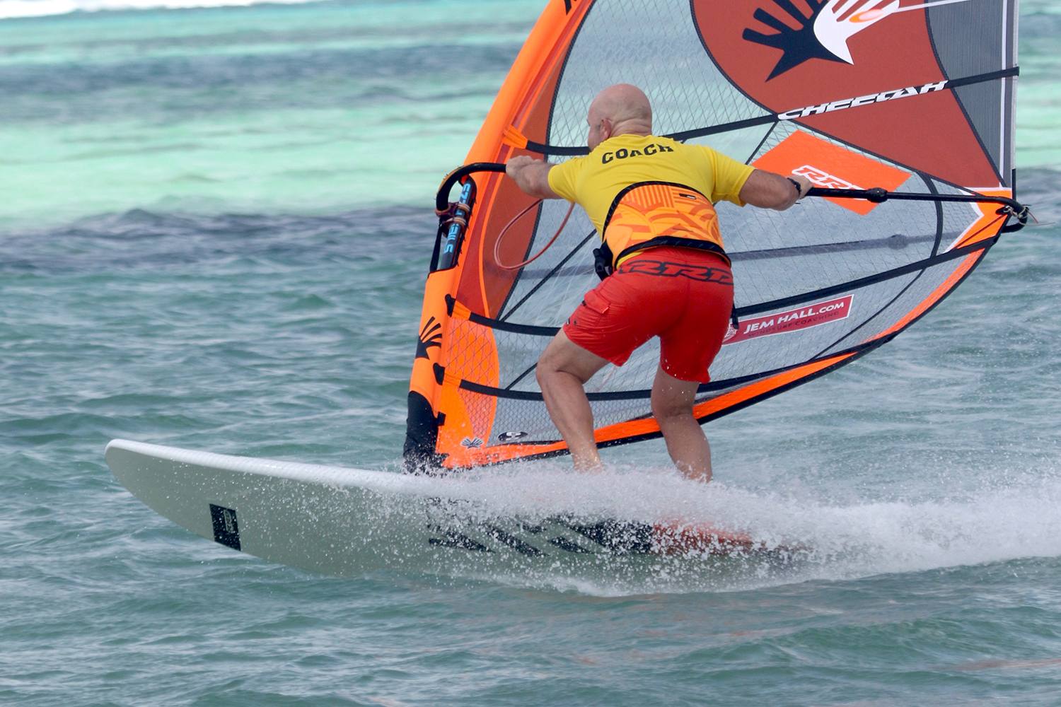 CAPTION: Front foot carve gybes help us attack and use the whole rail. Photo by Brett Kenny.