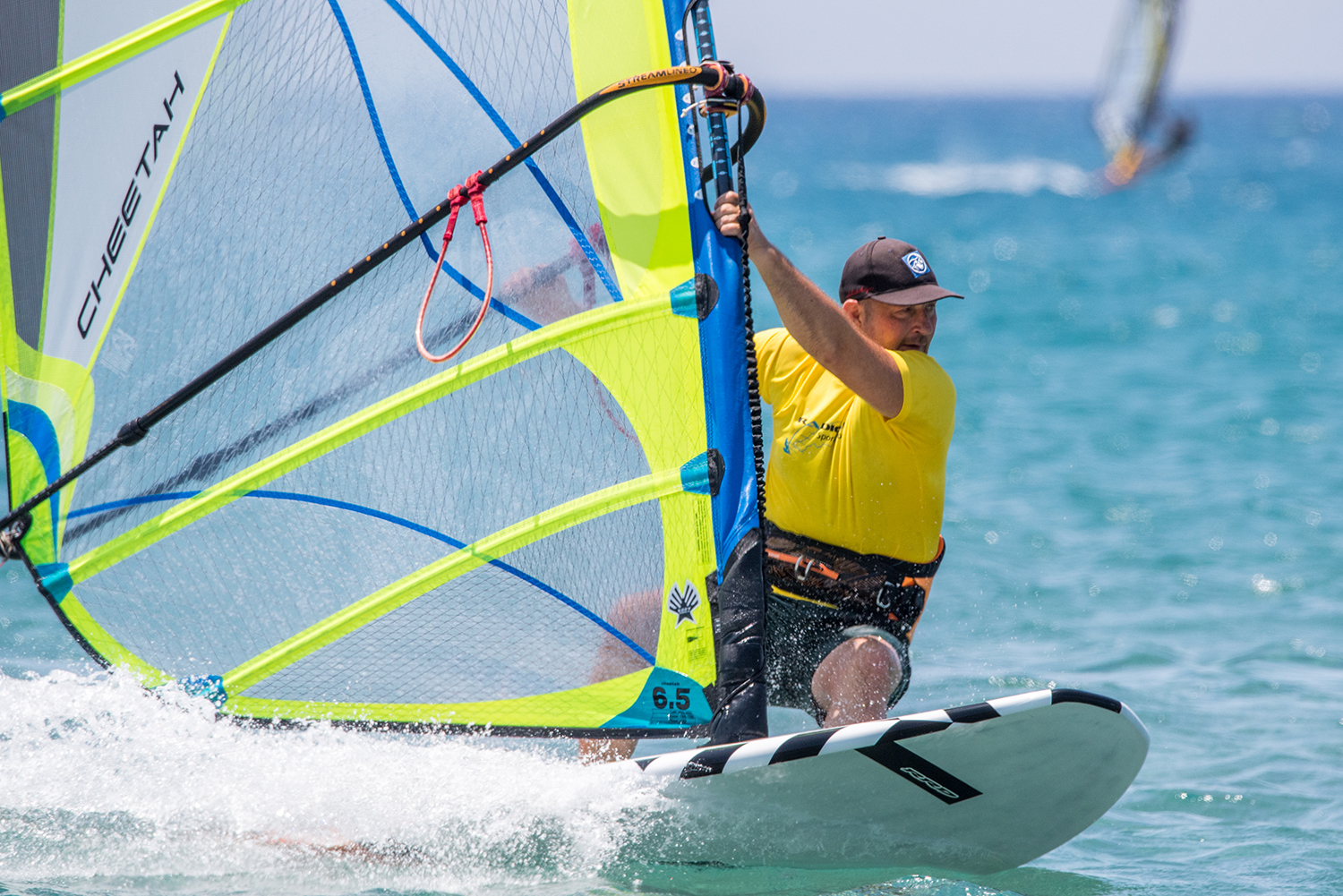 Moving the rig back as the hips swing forward and out gets you on the front foot in your tack approach. Photo by Eye Sea You.