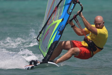 Pushing down hard on the front foot and leg from an outboard position will pin our board down. Photo by Brett Kenny.