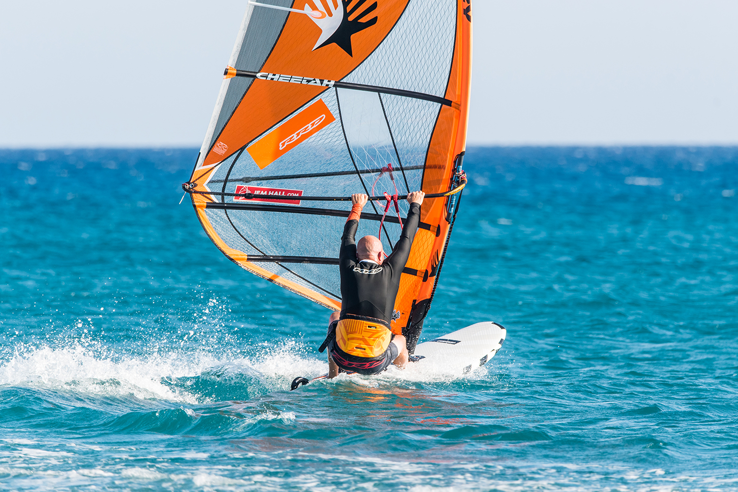 CAPTION: Changing your sailing line to more off the wind gets you planing earlier and often is the key to making planing gybes. Photo by Eye Sea You.