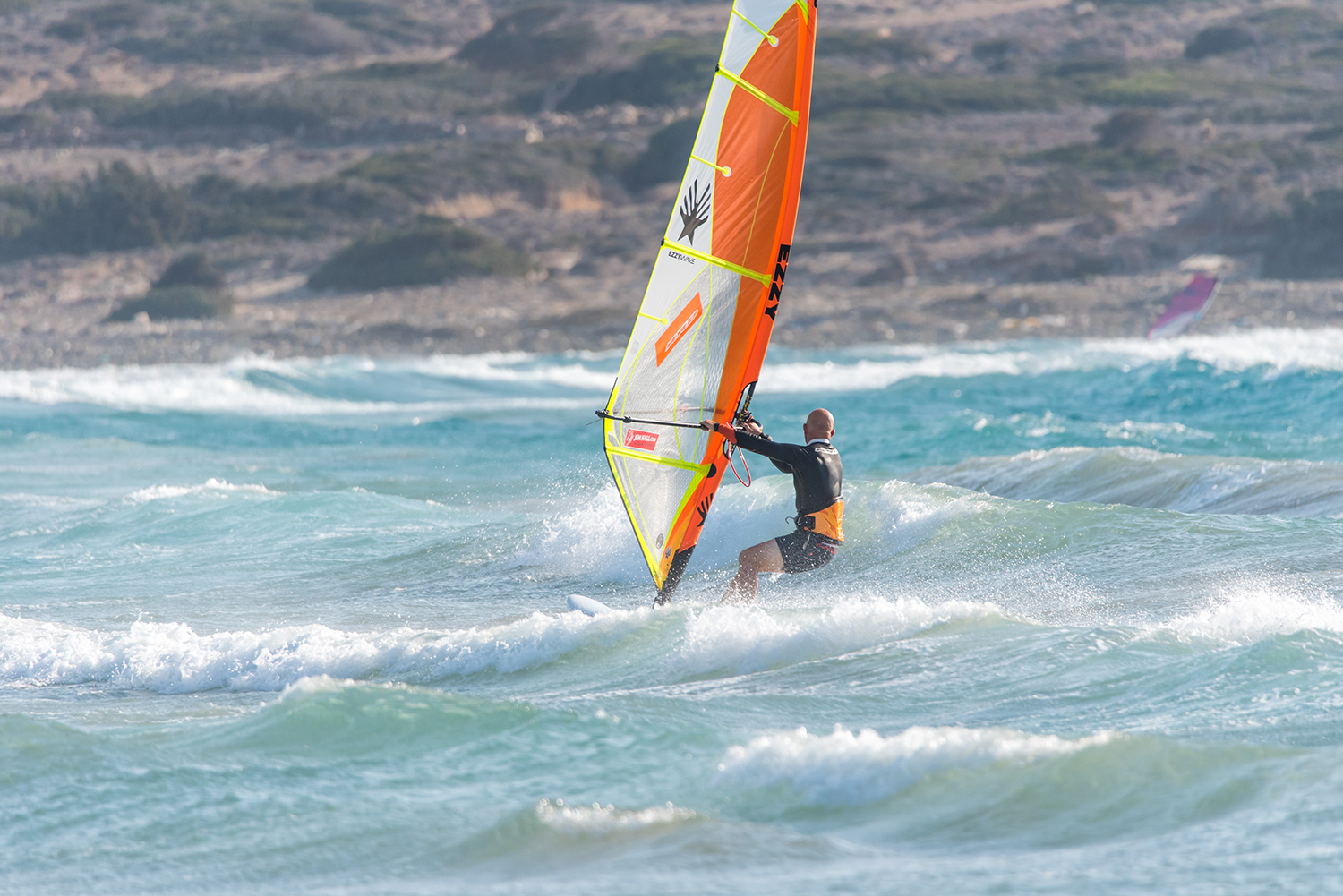 In onshore winds heading downwind prior to take off will get the sail lighter, give you more options and get your board speed up ready to boost more height. Photo by Eye Sea You.