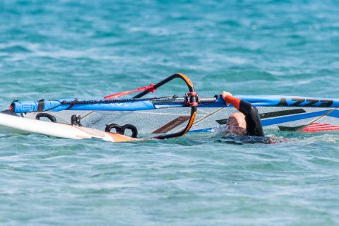 Trying to lift the sail without enough swimming or a rig across action will see you drinking plenty of seawater.