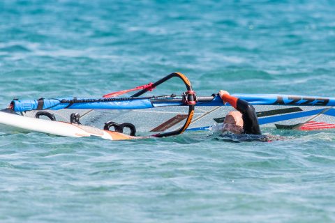 Trying to lift the sail without enough swimming or a rig across action will see you drinking plenty of seawater.