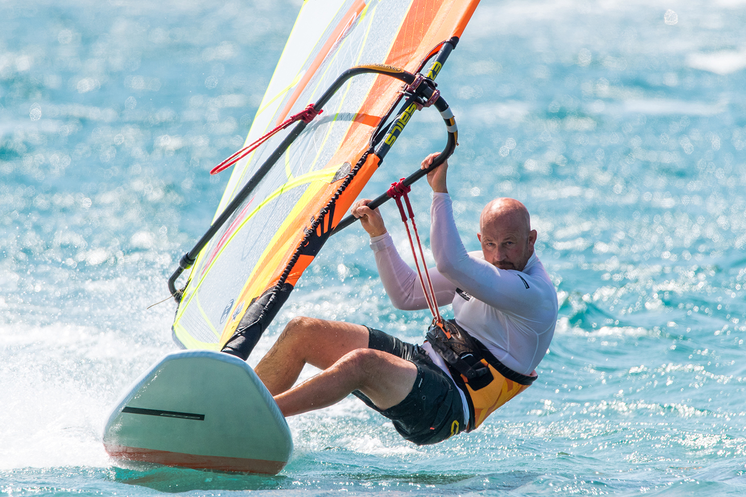 Really dropping your hips down and out will help you sheet the sail in and keep the board flat when well powered.