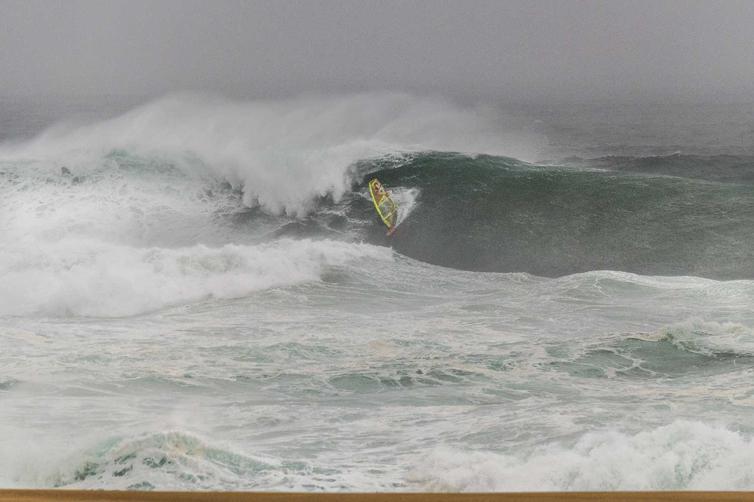 Thomas deep in the pocket at Nazare. Photo Heidi Hansen