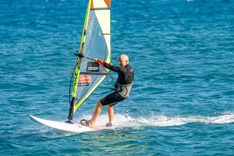 Get that back hand back and be ready to unhook and then head upwind. Sheet the sail out slightly to further help slow the board down.