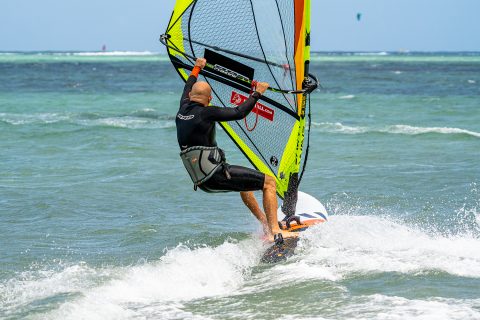 Keep that mast arm out to sheet out when exiting your gybes clew first, so that the sail has time to breathe and this will give you more balance.