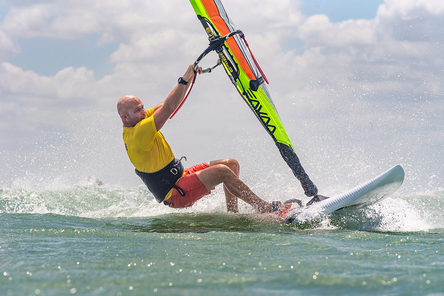 Land with a bent back leg, sail not too sheeted in and arms extended. This will help you land softly and catch some wind for a smooth getaway.