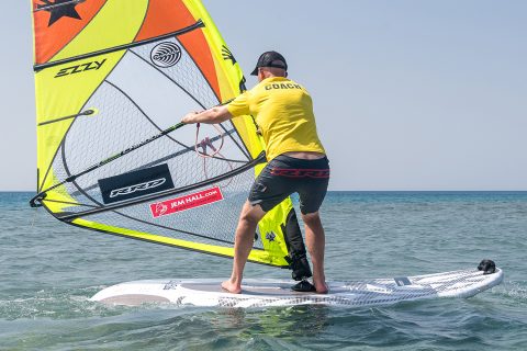 Just before head to wind, shift your vision to see the new side of the boom. Most of your weight is now on your front leg.