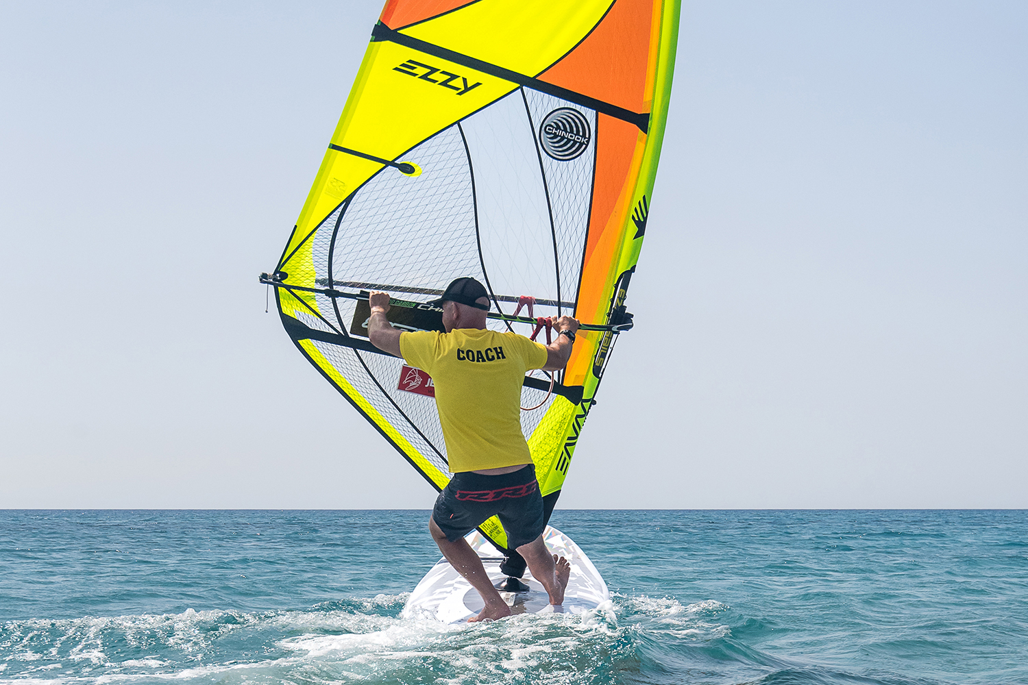 At dead downwind feel most of your weight on your back foot as you pull down on the boom and really bend your back leg. This makes you ready for the foot change.