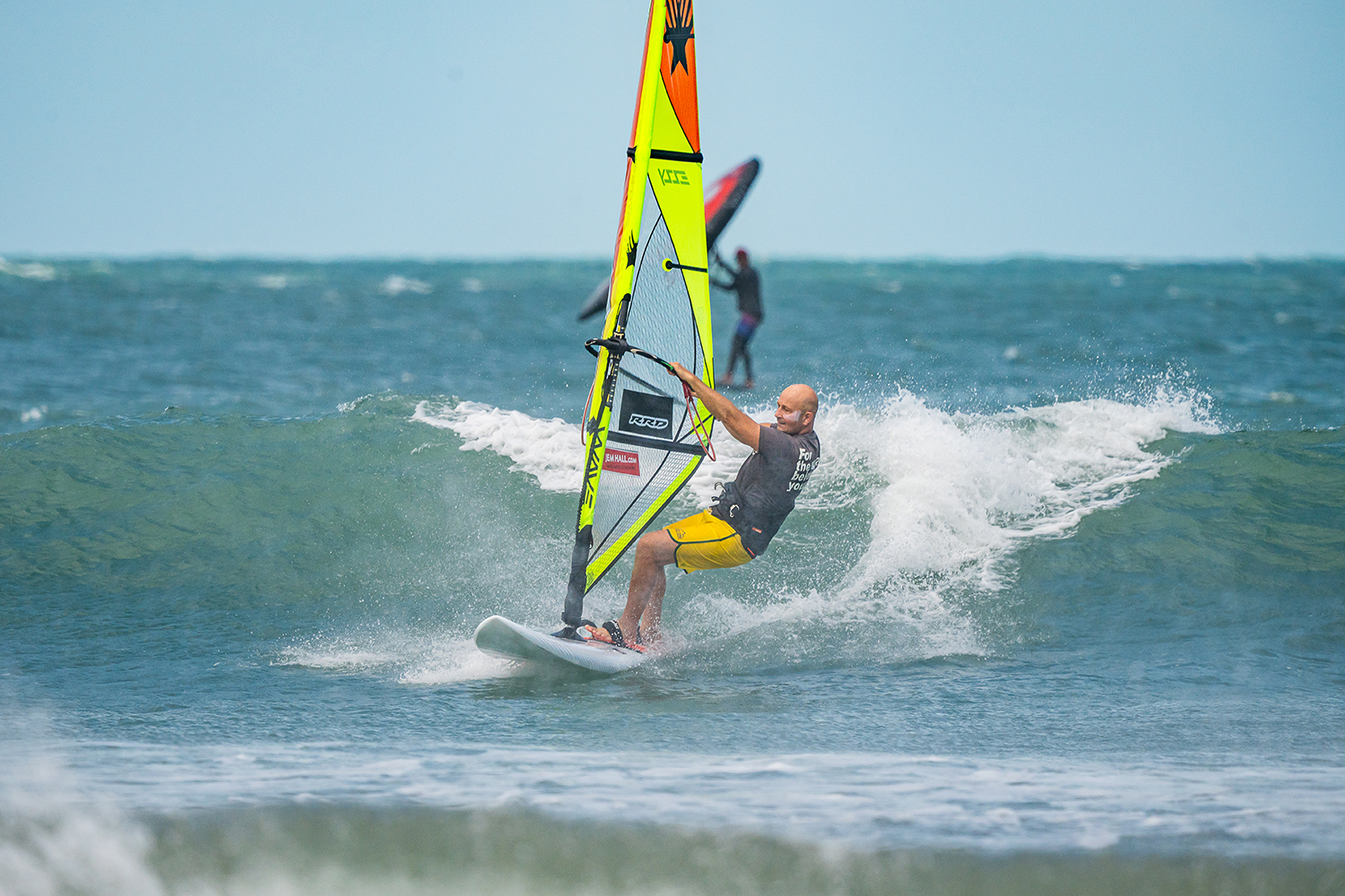 Drop down the wave and transfer a little bit of weight on to your heels to take you away from the wave and help you roll forwards and carve into your bottom turn.