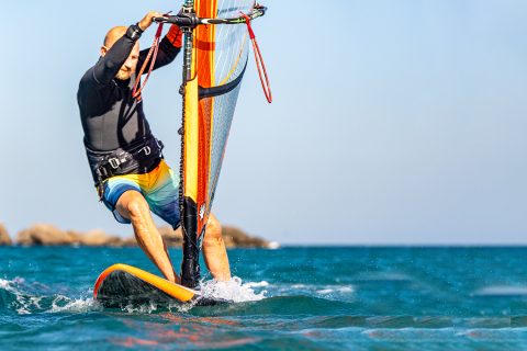 Precision; with the hands it is about having your backhand by the back line on the entrance and your front hand low on the mast. Having your front foot forward and on the mastfoot helps your footwork, and helps prevent the nose sinking, which will then help you get your back foot back past the rear footstrap.