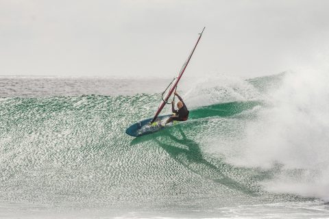 Kai carving on a butter smooth wave