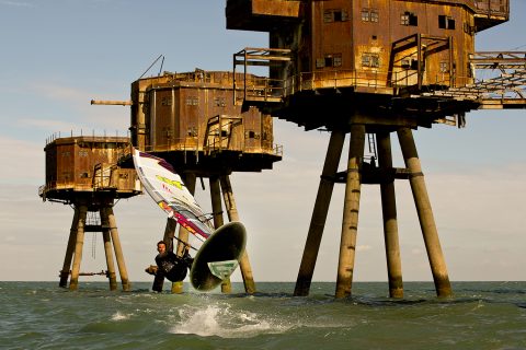 Nik Baker jumping in front of the Mounsell Forts in the Thames